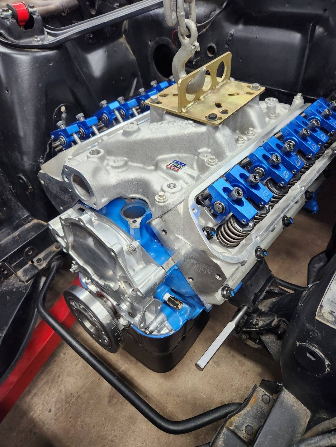 Detailed engine bay wiring work at Foulks Performance